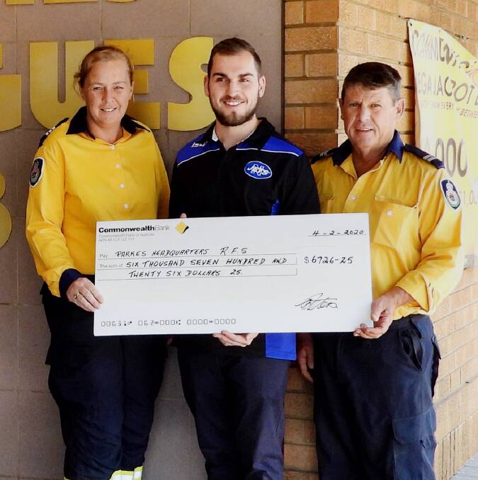 Parkes Rural Fire Service Captain Vicki Williams and Senior Deputy Captain Steve Chester accepted a hefty donation from Parkes Leagues Club Manager Luke Malam. 