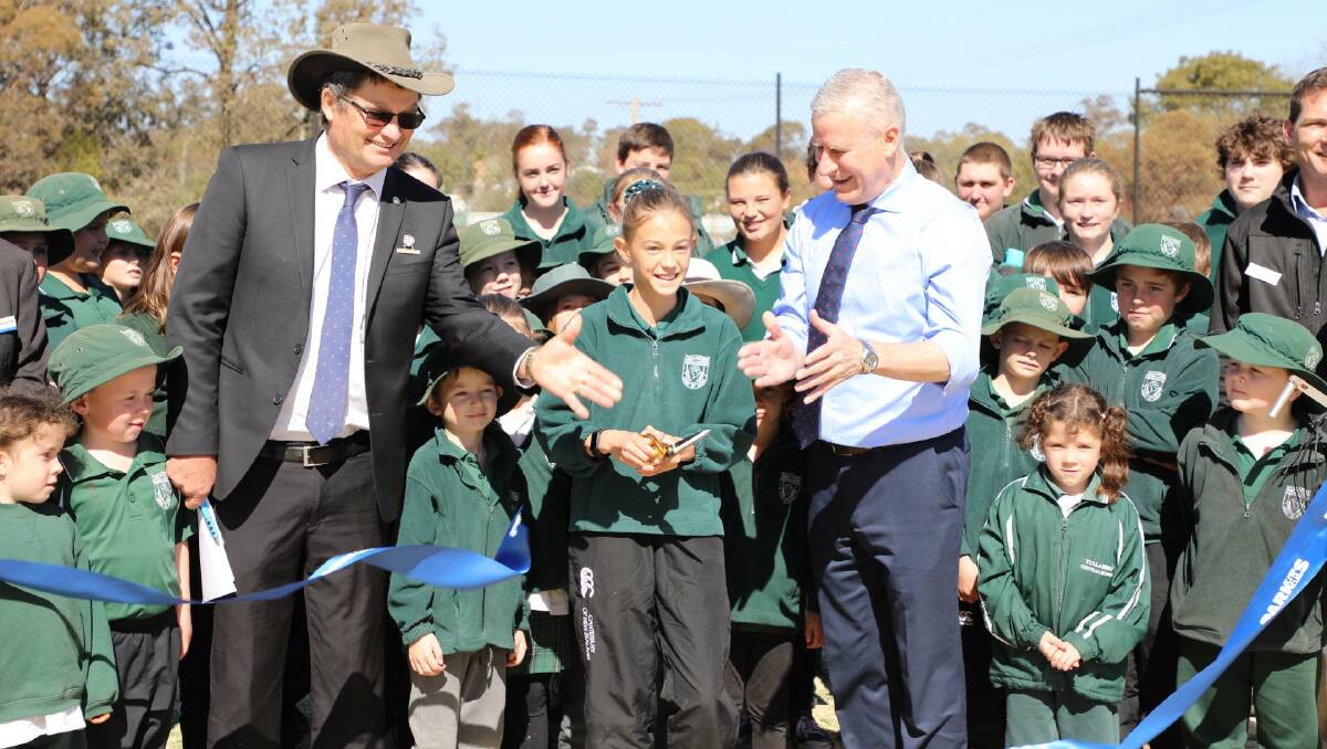 REVITALISED: Cr Neil Westcott and Deputy Prime Minister Michael McCormack joined Tullamore school students to officially open the new Tullamore Multicourts. Photo: Supplied.