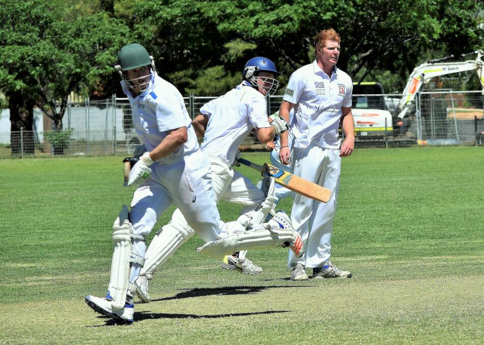 SENIOR CRICKET: Peter Yelland and Scott Knights make a run in last year's Grinsted Cup. Photo by Jenny Kingham. 