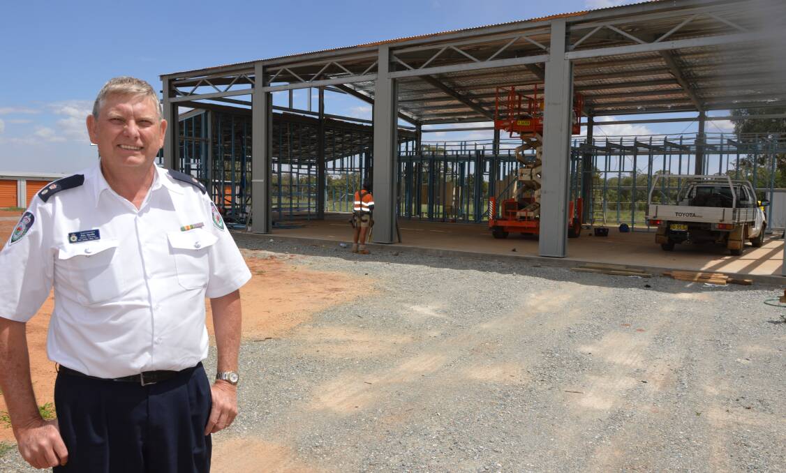 NOT LONG NOW: NSW Rural Fire Service Mid Lachlan Valley district manager Superintendent Ken Neville checks out the progress of the new station in Hanlon Street. Photo: Barbara Reeves