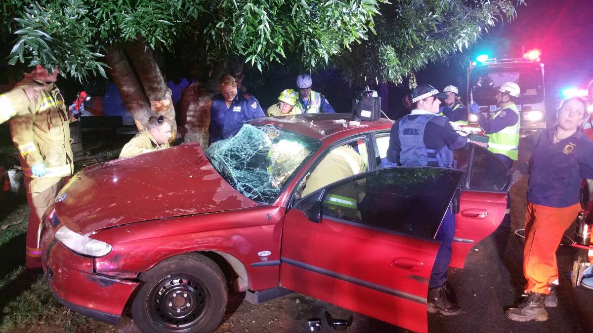 A Forbes man was trapped in his car for about 90 minutes after crashing into a tree in Ryan Street on Saturday night.  
