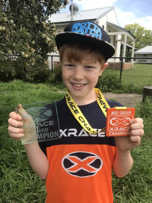XMEN: Xander Greef and his father Daniel finished first and second in the Sydney XRACE. Xander was awarded Grand Champion as well as the age group champion for nine-year-old boys. Photo: Supplied.