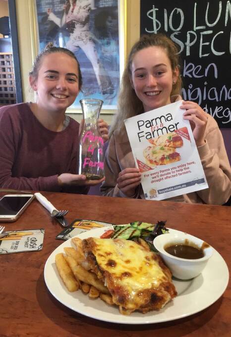 DROUGHT RELIEF: Hannah Noakes and Lauren Chester are supporting Parma for a Farmer at the Parkes Hotel. Photo: Parkes Hotel Facebook page.