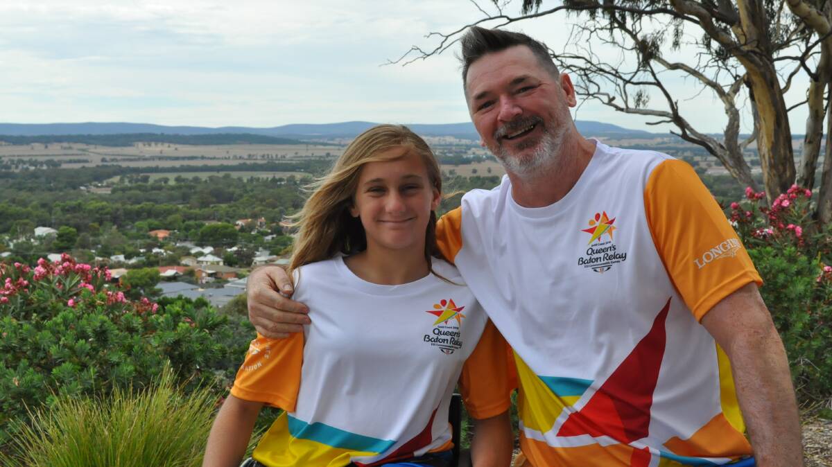 THE SMILES SAY IT ALL: Victoria Simpson and Darrin Gibson are extremely proud to be selected as two of the 21 Queen's Baton Bearers from Parkes. Photo: Will Flynn. 
