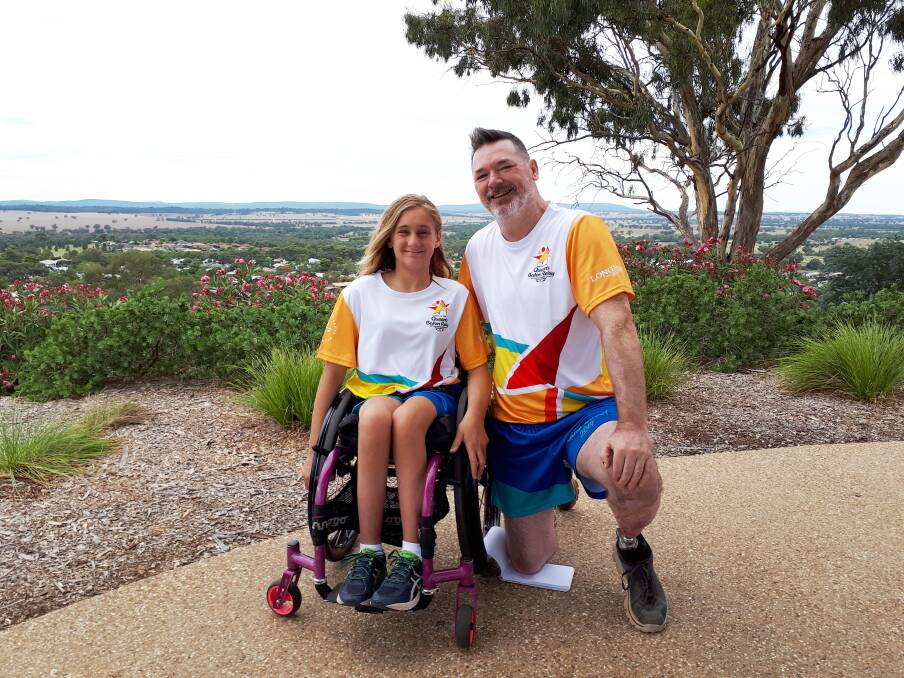 PROUD: Victoria Simpson and Darrin Gibson are extremely proud to be selected as two of the 21 Queen's Baton Bearers from Parkes. Photo: Will Flynn. 