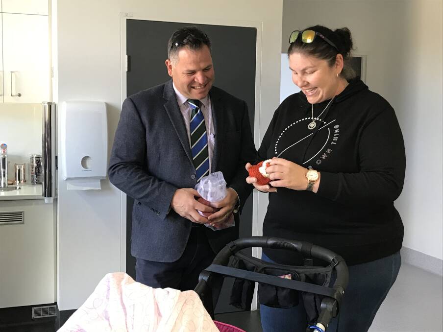 FIERCE ADVOCATE: Phil Donato with a new mother at Parkes Hospital Maternity Unit last year. Photo: Supplied.