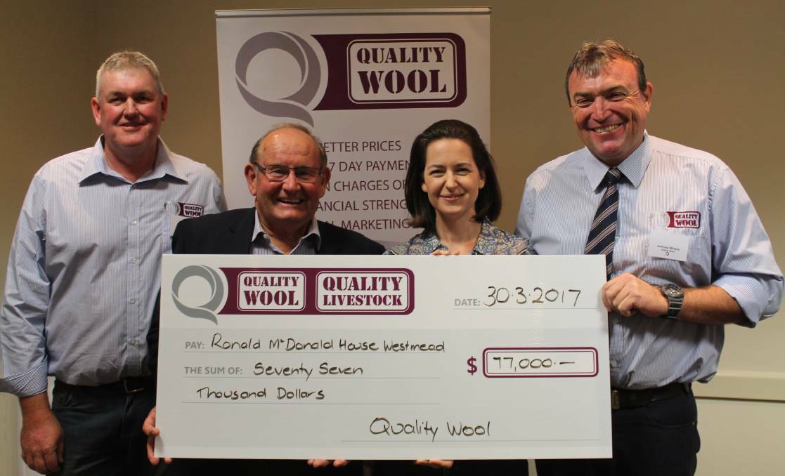 Quality Wool's NSW Operations Manager Chris Scott (left) and Area Manager Anthony Windus (right) presenting a cheque to Ray Finn and Belinda Woolford of Ronald McDonald House Westmead after last year’s charity wool drive. 