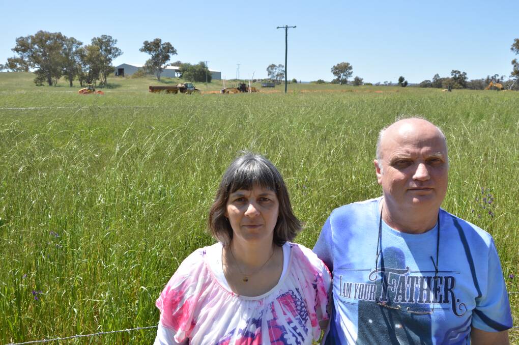 Robbie and Phil McFadyen are unhappy about the $36 million Trewilga Realignment Project which now runs just 170 metres from their boundary fence. They want their privacy back, and the noise from roadworks and traffic to be bearable. Photo by Barbara Watt. 