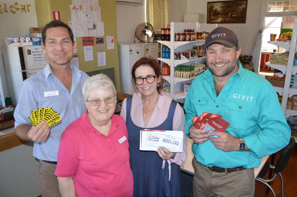 Parkes Shire's Drought Response Officer Roger Kitson, Anglicare volunteer Sandra Milling and manager Natalie Quince and GIVIT NSW Drought Relief Manager Scott Barrett are pictured at Georgie's Pantry with food, fuel and clothing vouchers for drought affected people. 