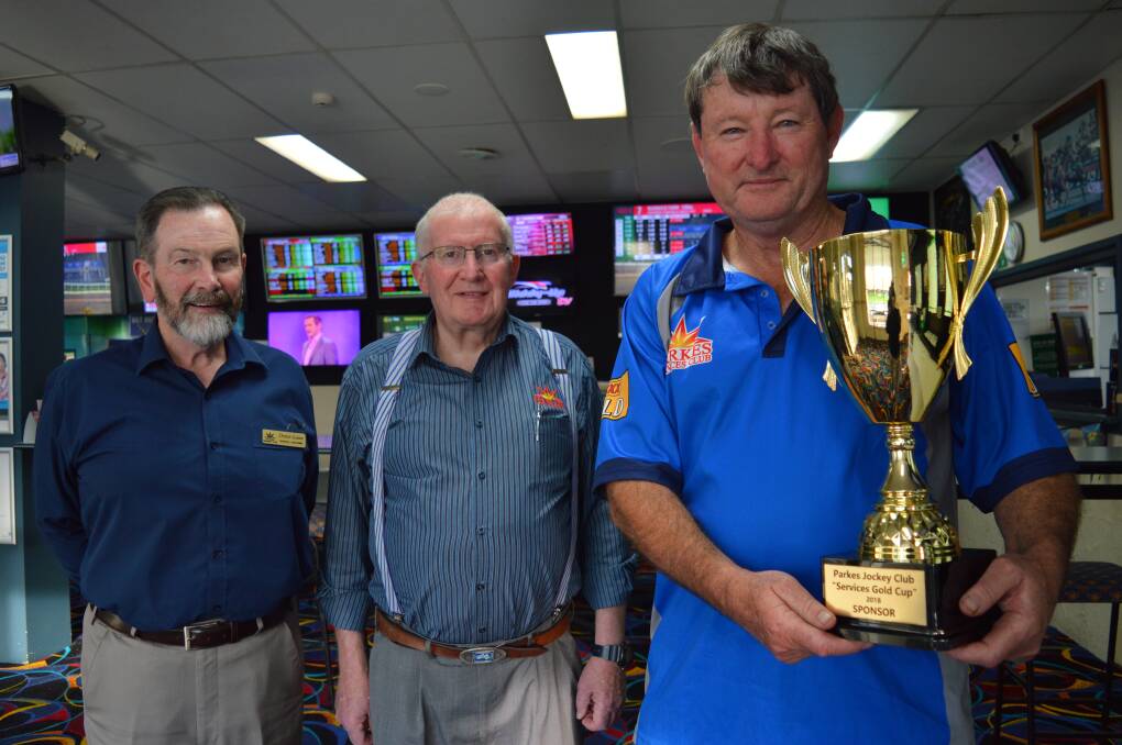 RACING: Parkes Services and Citizens Club general manager Denis Lane, president Terry Knowles, and Parkes Jockey Club president Mark Ross, with the Gold Cup. Photo: Christine Little.