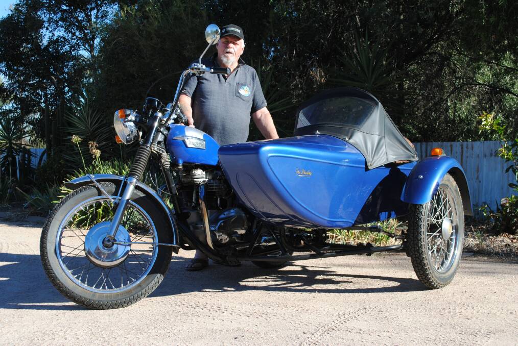Bob Morton with his 1963 Triumph TR6SS motorbike which has been fitted with a Dusting sidecar. Bob bought the bike and sidecar as a package.