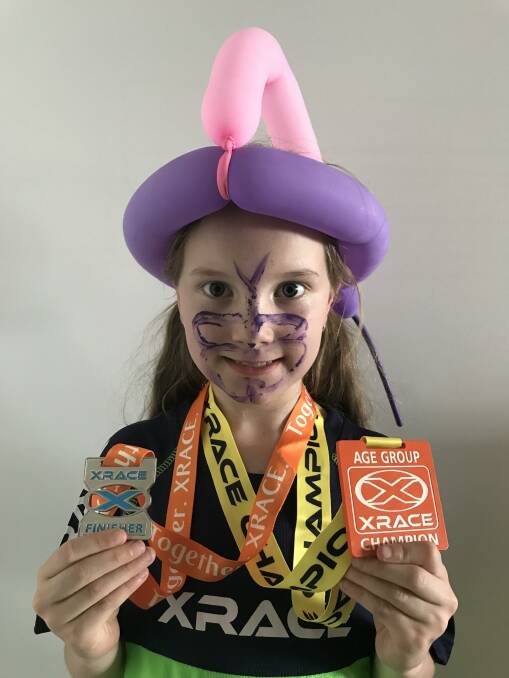 XRACE CHAMPION: Nine Year Old Girls Champion Evelyn Greef with her crown and father's face painting attempt of a butterfly. Photo: Supplied.