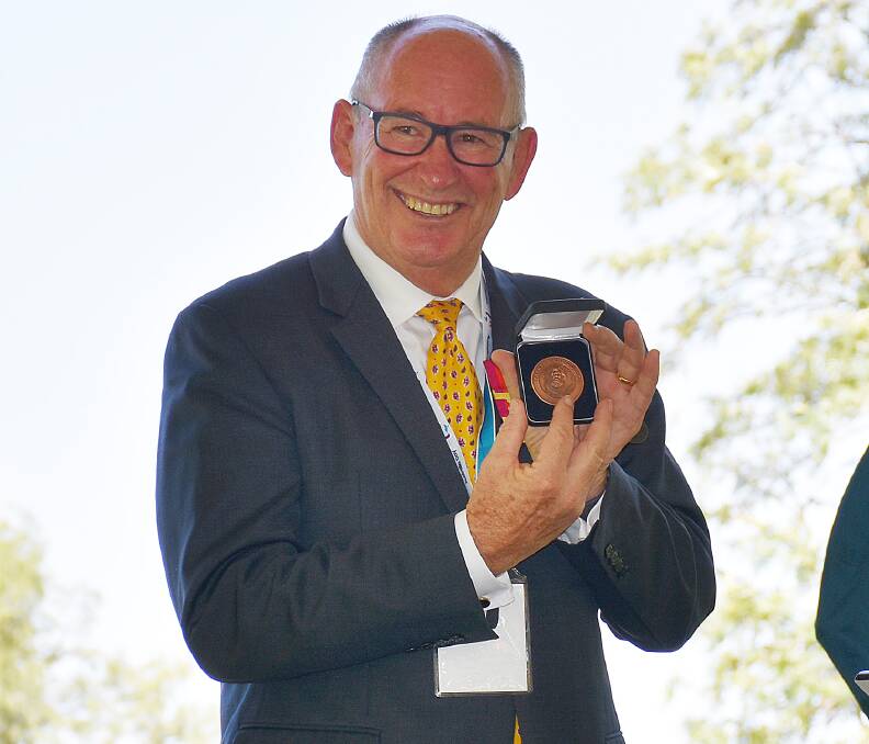 THANK YOU: Australia Day Ambassador Allan Sparkes CV OAM VA was given a Parkes Shire medallion after his address at the official ceremony. Photo: Barbara Reeves.