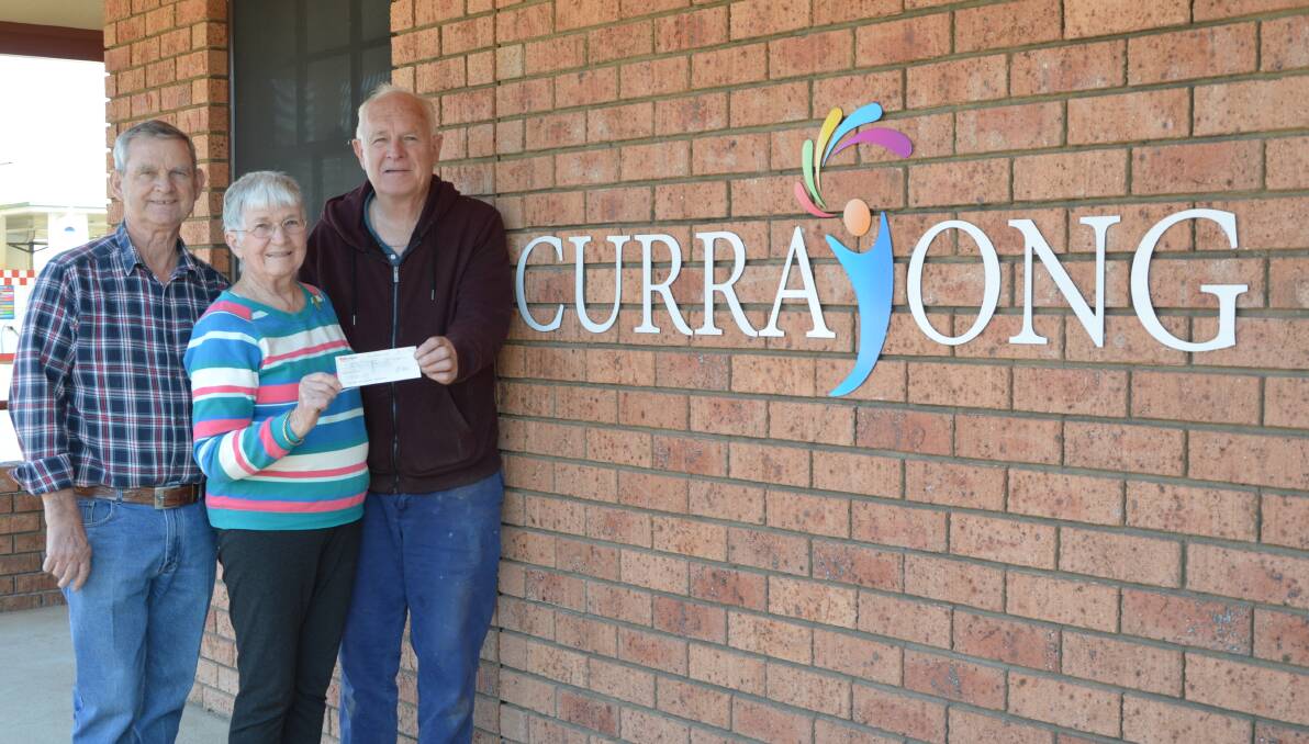 SUPPORT: Painting Group members Kim Chambers and Helen Huntly presented a cheque for $1000 to CDS Chair Neil Unger. Photo: Barbara Watt. 