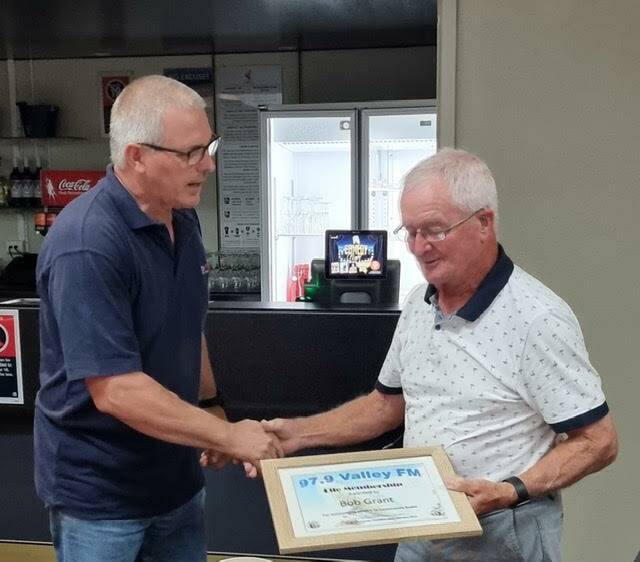 LIFE MEMBERSHIP: Lachlan Valley Radio president Greg Whitworth congratulates and thanks Bob Grant. Picture: SUPPLIED