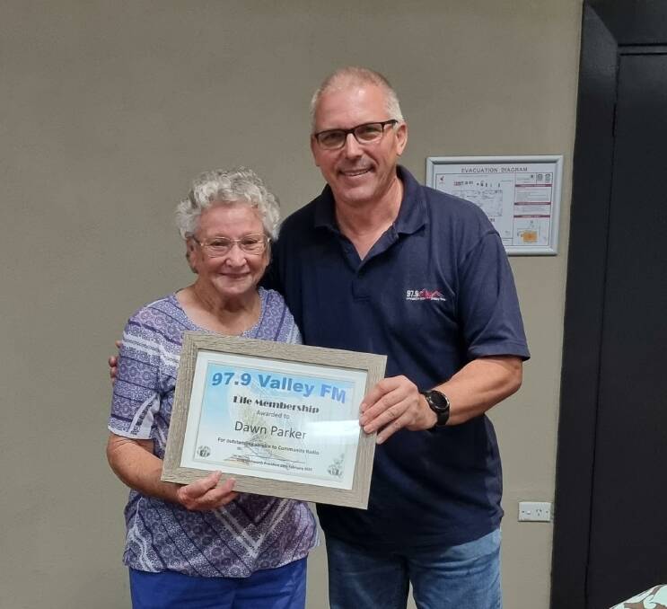 LIFE MEMBERSHIP: Dawn Parker accepts her life membership certificate from Lachlan Valley Radio president Greg Whitworth. Picture: SUPPLIED