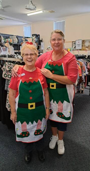Elf helpers Judy Brown and Donna Hunt were among those to help pack gifts for The Salvos for Forbes families. Picture supplied