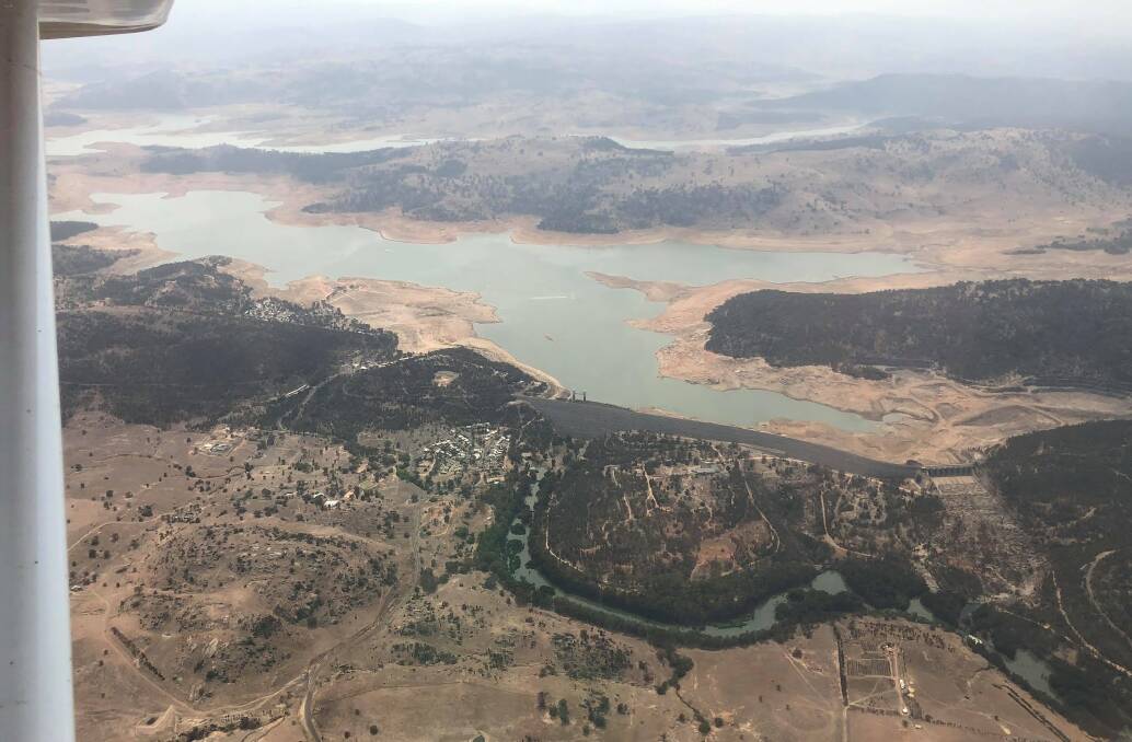 An aerial view over Wyangala Dam shows how low the water line is after one of the worst droughts the region has endured. Photo: RICK MIDDLETON