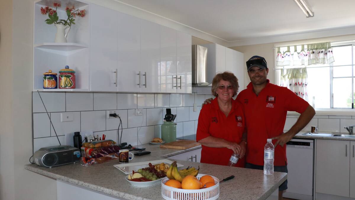 Mark Ranger in his renovated kitchen with volunteer Shirley, who came all the way from Queensland. 