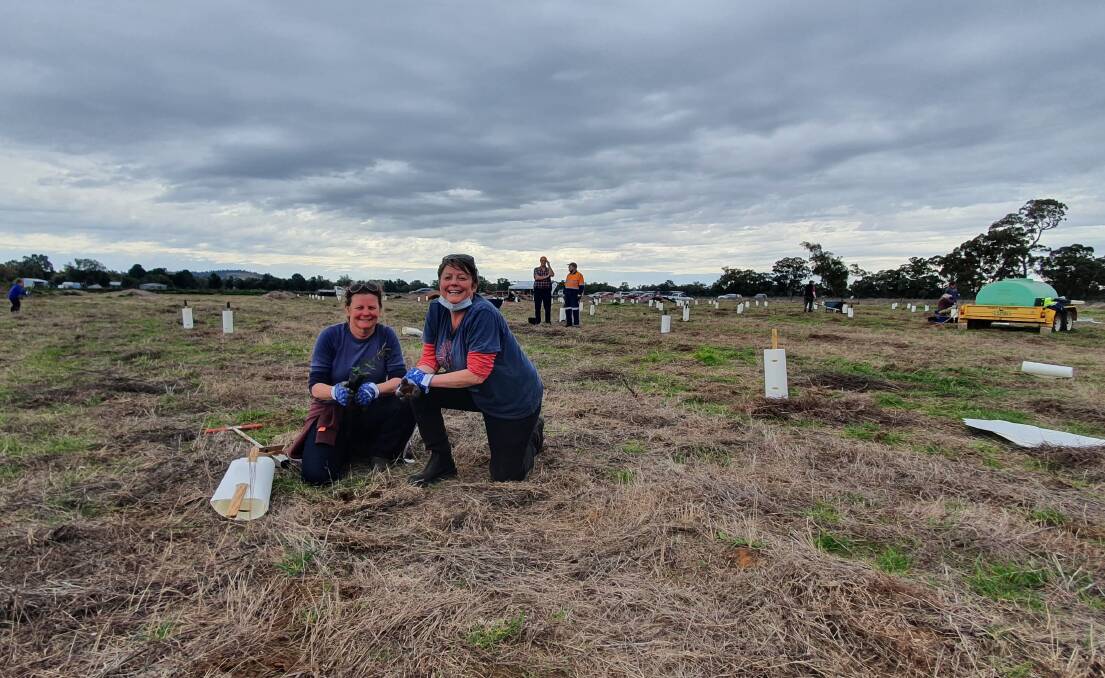 BE PART OF IT: Deb and Kerryn Jones joined the National Tree Day planting effort in Parkes. Picture: CENTRAL WEST LACHLAN LANDCARE