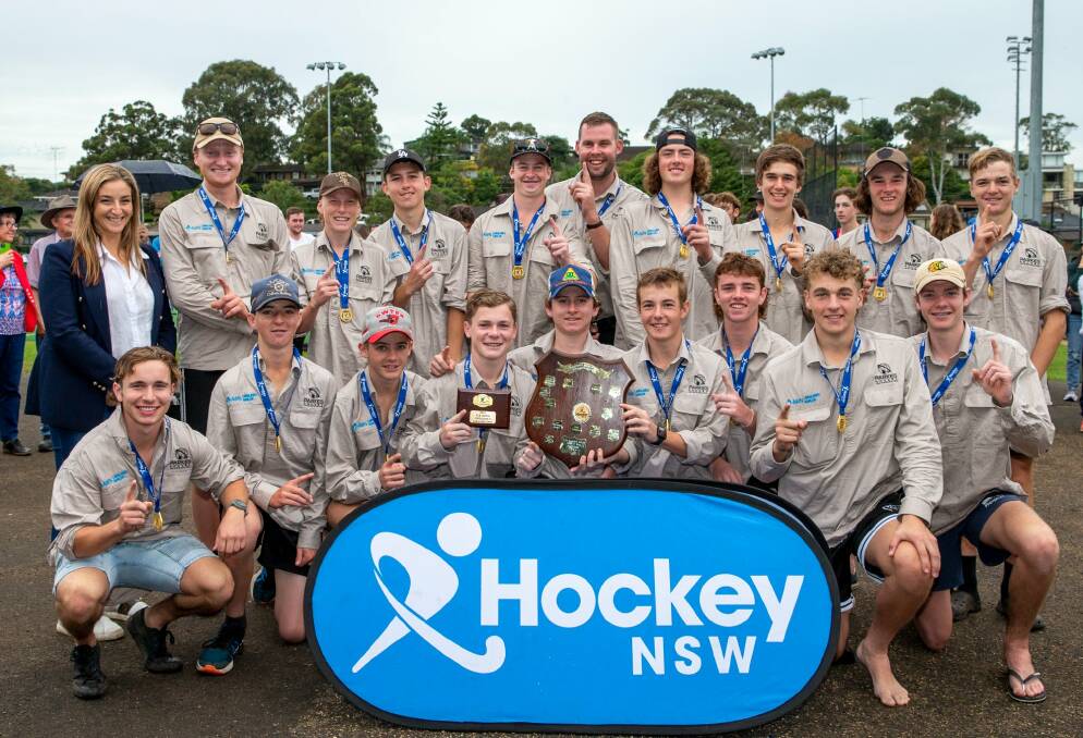 WINNERS ARE GRINNERS: Back Jack Westcott, Flynn Thompson, Nathan Marshall, Ollie Brown, Jordan Grosvenor, (manager) Zanda Johnstone, Joseph Tanswell, Jakob Chambers, Archie Rix (front) Will Searl (coach) Ryan Dunford, Jack Skinner, Tom Searl (captain), Cody Kirk, Toby Collins (captain) Ted Murray, Kane Macfarlane, Jack Rice. Picture: HOCKEY NSW