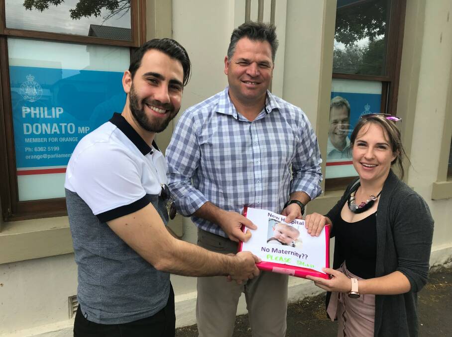 PETITION: Member for Orange Phil Donato with NSWNMA members John-Paul Marx and Hannah Wilton, who is also a midwife in Parkes. 