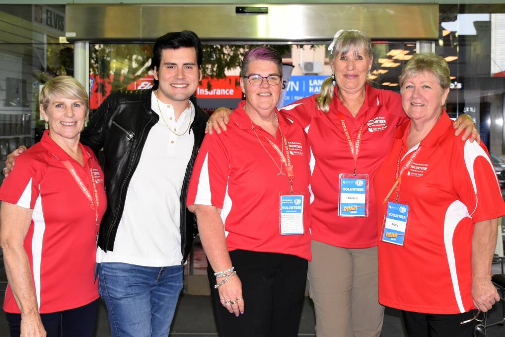 BEST EVER: Feature artist Taylor Rodriguez with festival volunteers at Elvis Central. Picture: JENNY KINGHAM
