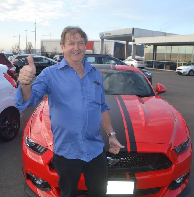 THUMBS UP: Professional truck driver Colin Ahearn stopped at the Tullamore Hotel for dinner and came away with $6,000 and a mustang. Photo: CONTRIBUTED