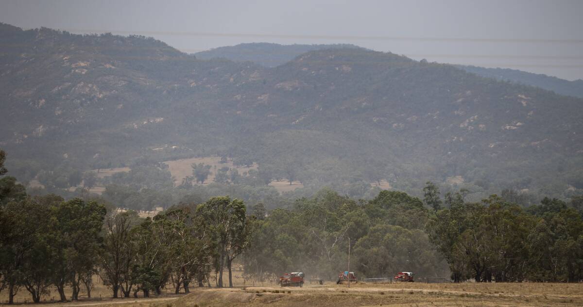 DANGEROUS FIRE: Trucks headed toward Woomargama National Park during the summer bushfires. A Holbrook man is angry at RFS management, but thankful to the firefighters for their hard work.