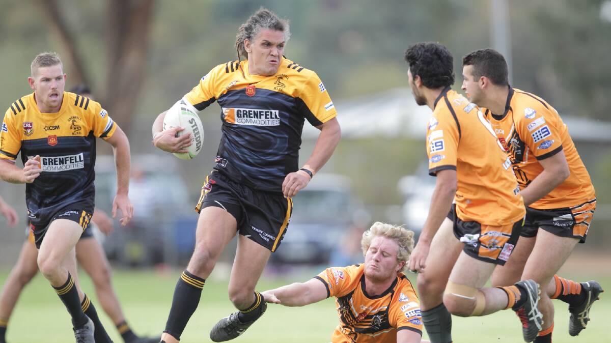 IN THE HUNT: Grenfell's Stevie John Ingram takes the ball into the Tigers defence, both clubs are in the running to finish in the Woodbridge Cup top five. Photo: RS WILLIAMS