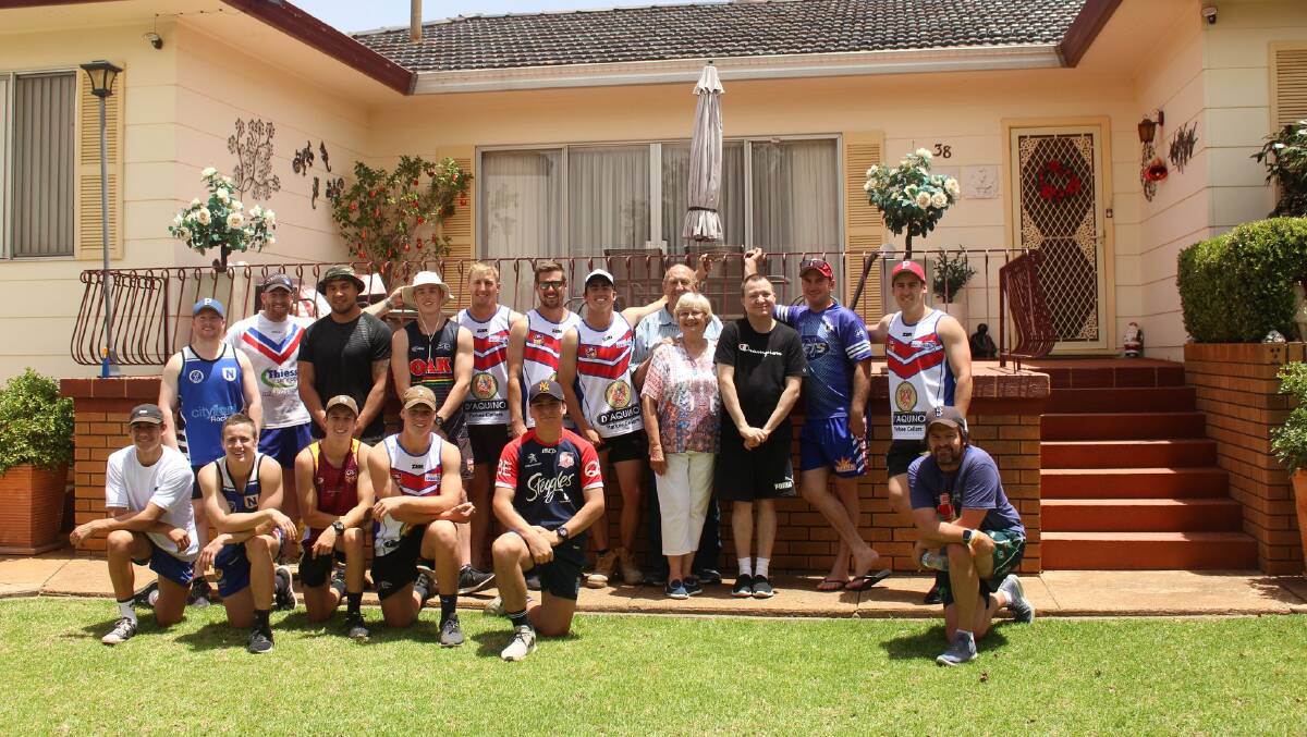 HELPING HAND: Spacemen players helped out a couple of the club's old boys on Saturday, mowing lawns, cleaning gutters and trimming hedges. Photo: PARKES SPACEMEN RUGBY LEAGUE PAGE