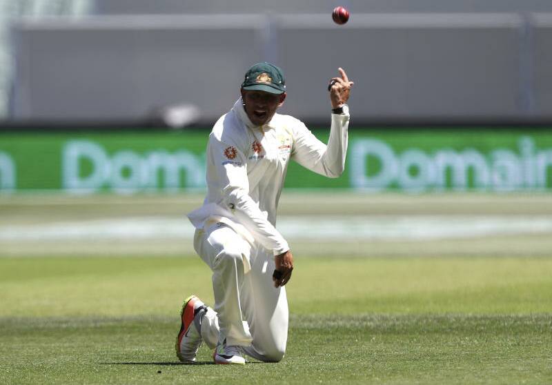 Australia's Usman Khawaja celebrates after taking a catch to dismiss India's Virat Kohli. Photo: AP