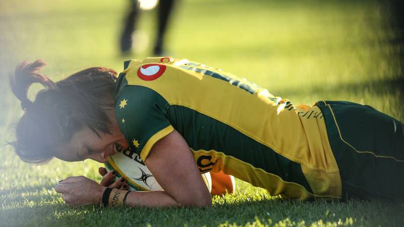Mhicca Carter scores a try for Australia against Japan at Newcastle in July. Photo: Marina Neil