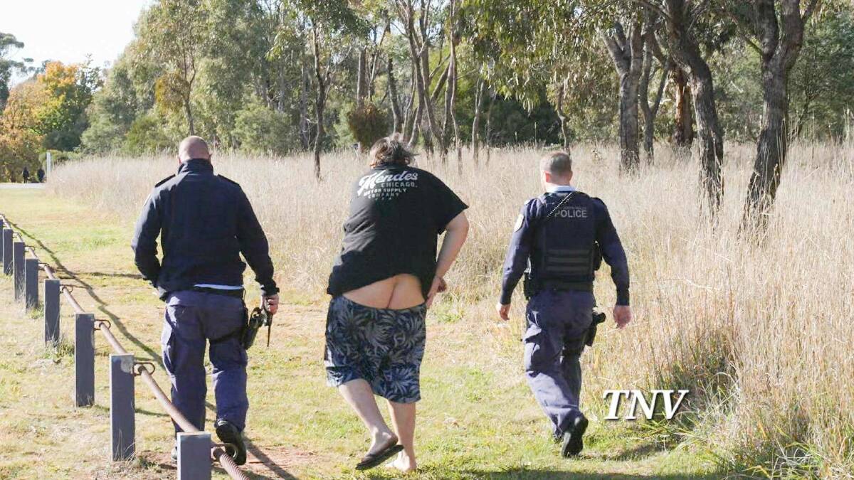 Jason Eggins being taken into custody by police at Gosling Creek reserve. Picture by Troy Pearson/TNV.
