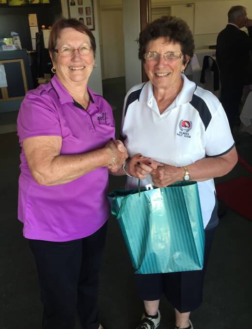 Colleen Flynn congratulates Saturday winner Barbara Donnelly at Parkes Golf Club.