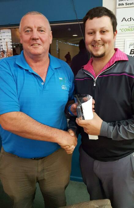 Parkes Golf Club captain Peter Dixon congratulates Zac Kelly on winning the August monthly medal sponsored by Peter Woods and Associates Chartered Accountants.