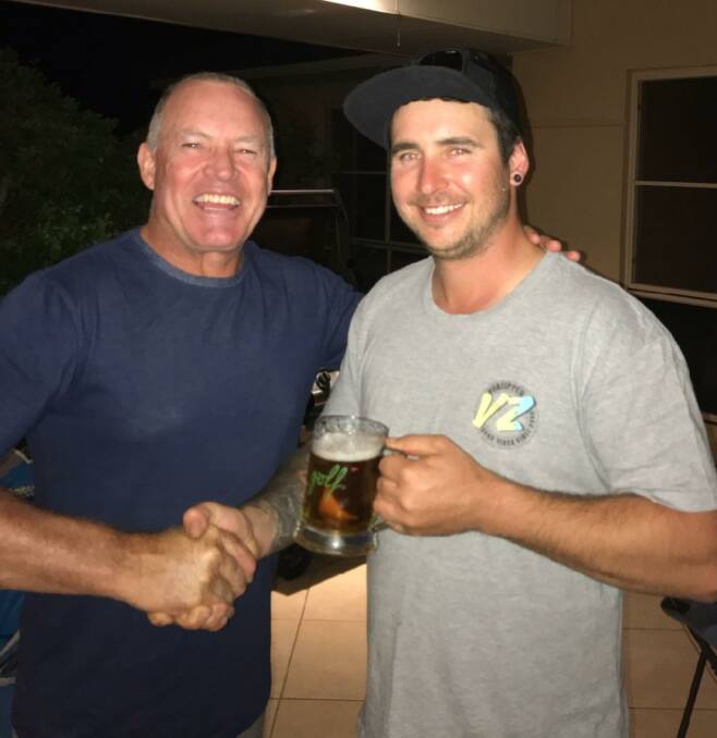 Parkes Golf Club's David Stevenson congratulates C Grade scratch winner Kyle Hutchings.