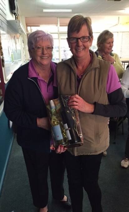 Lyn Davison congratulates Sue Holman on winning the Brian Collins Smash Repairs and Parkes Caravans ladies consistency award.