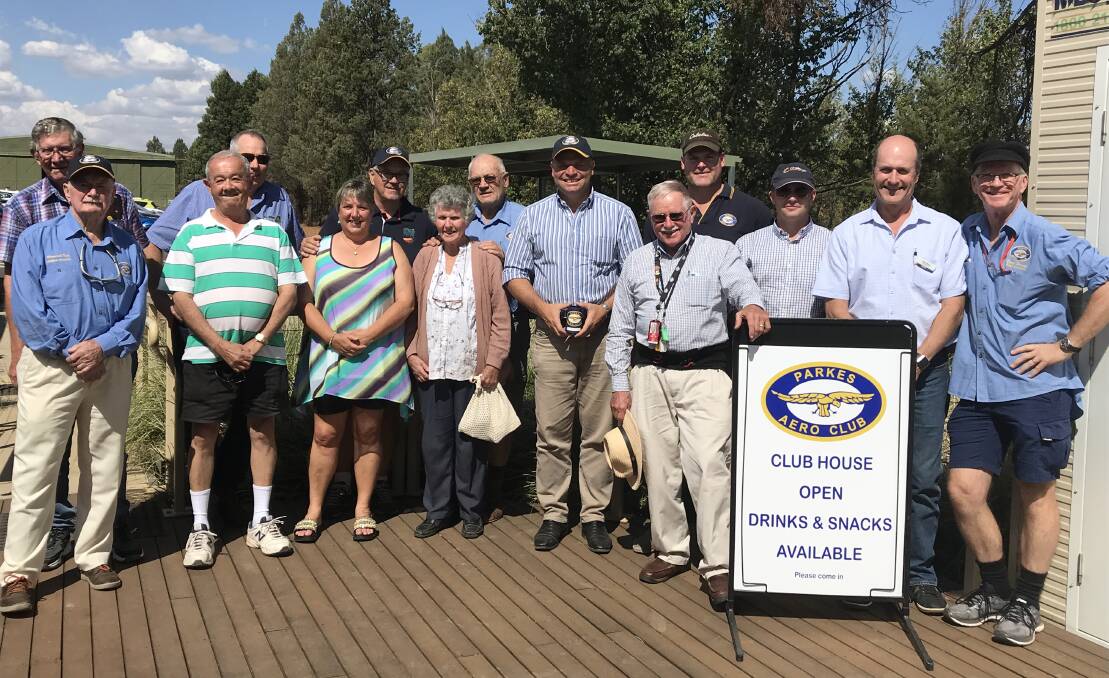 EXCITED: Member for Orange Phil Donato (centre) with members of the Parkes Aero Club last week after announcing they'll receive $20,000 to construct a new awning.