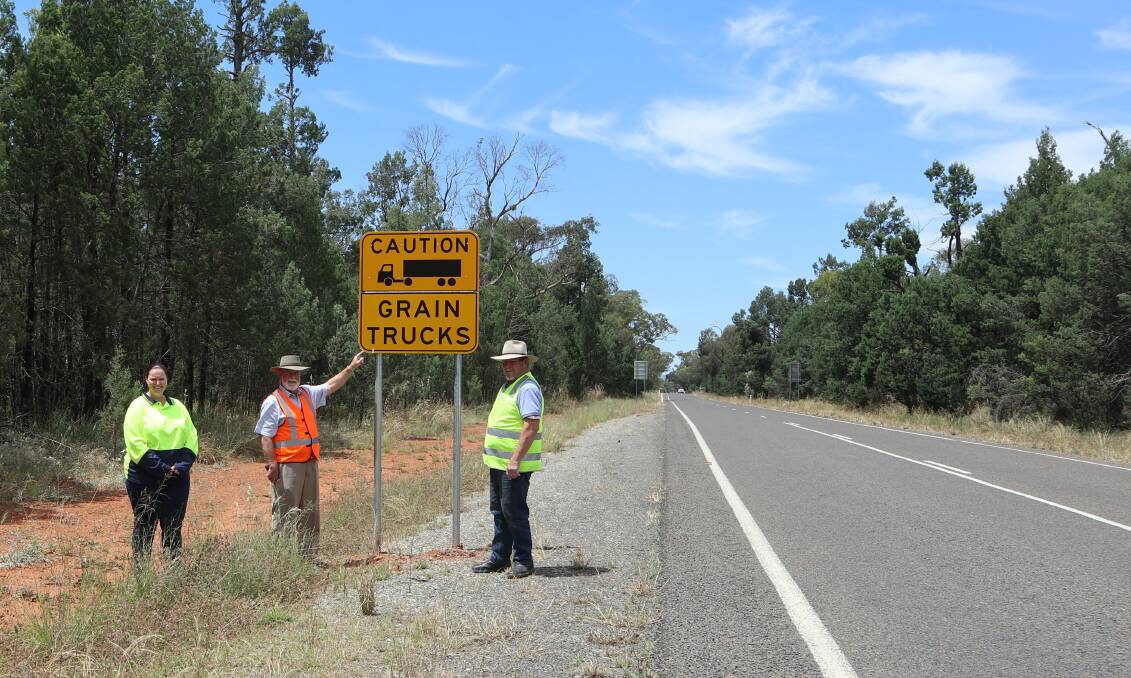 IMPORTANCE OF SAFETY: Melanie Suitor, Road Safety and Injury Prevention Officer with Parkes Mayor Ken Keith OAM and Cr George Pratt with some harvest safety signs. They are the first of their kind in NSW.