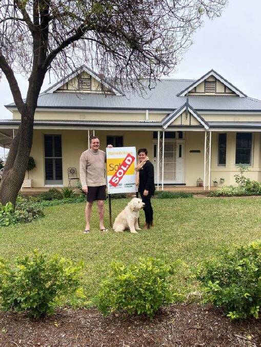 Raine and Horne agent Sandra Tidsley with a happy new Parkes home owner.