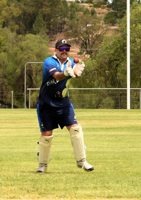 Keeper Ronald Wykamp takes a catch to dismiss a batsmen in a match earlier this season.
