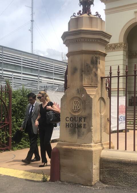 BEFORE COURT: Dr Khin Thet (left) leaves Dubbo District Court with a legal representative. Photo: ZAARKACHA MARLAN