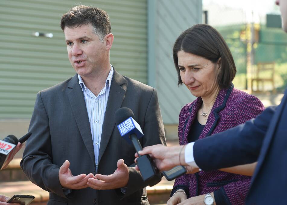 Left to do the explaining: Justin Clancy with NSW Premier Gladys Berejiklian in Albury last year. He has the job of outlining the government's border crackdown.
