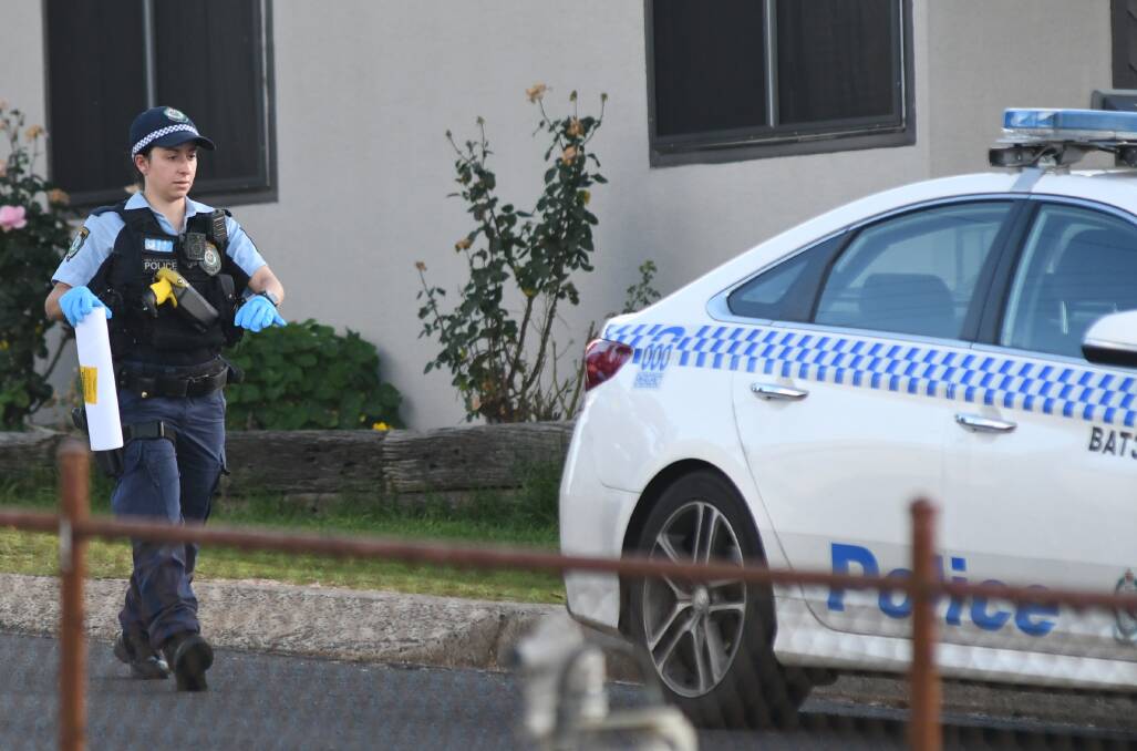 INVESTIGATION: Police on the scene of an alleged home invasion in West Bathurst on Wednesday afternoon. Photo: CHRIS SEABROOK.