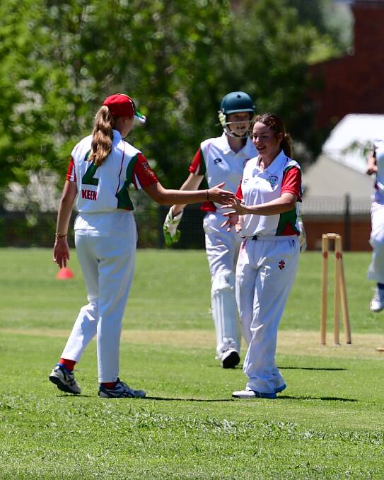 DONE AND DUSTED: Amali McNeil (right) celebrates the winning wicket for Western in Thursday's concluding game against South Coast. Photo: ALEXANDER GRANT