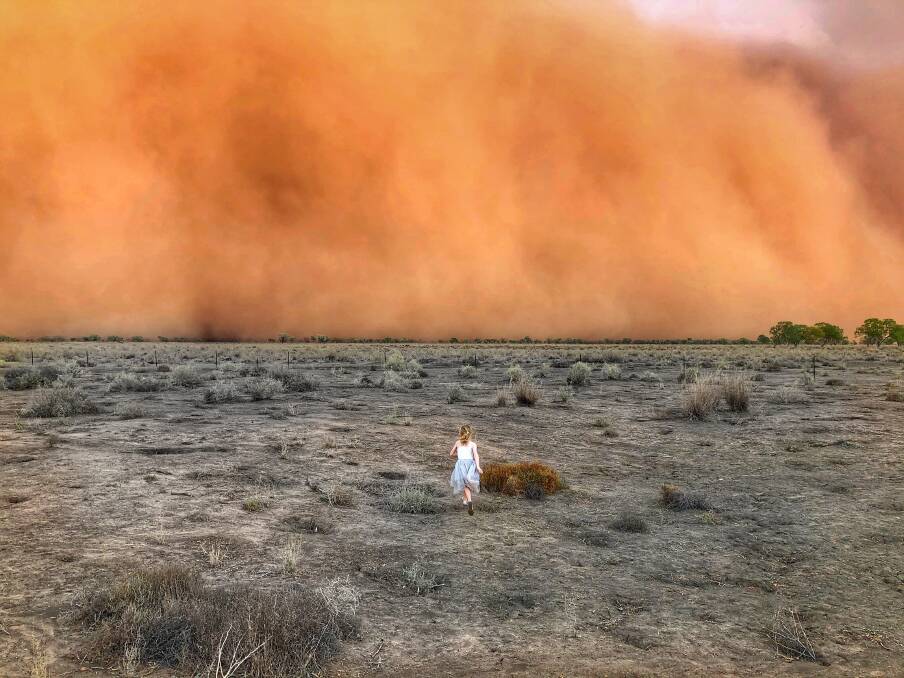 WINNER: Marcia McMillan's awe-inspiring photo of her daughter Raphaella running into a duststorm near Nyngan. Photo: Marcia McMillan
