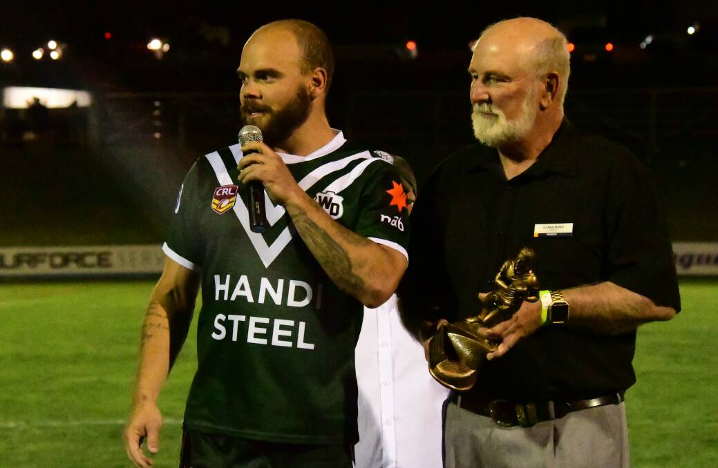 HONOUR: Aidan Ryan speaks to the crowd after being presented Western's man of the match award by Parkes Shire Council mayor, Ken Keith OAM. Photo: NICK GUTHRIE