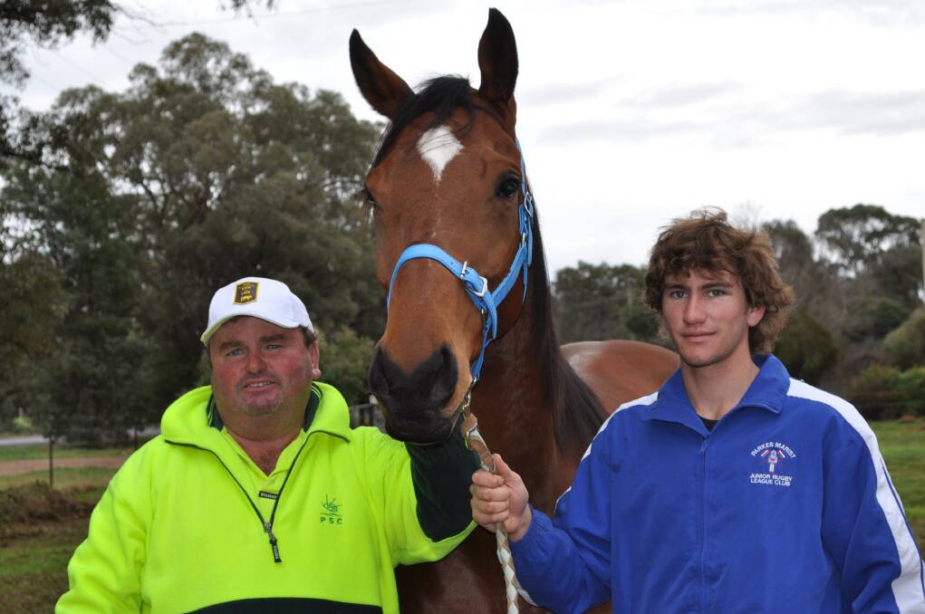 ONE OF THE BEST: George Wright (left), with his son George Jnr and Darcy Legend, one of the countless number of horses he took all over the west, after winning the 2010 Central Districts Picnic Racing Trainer's award. Photo: FILE