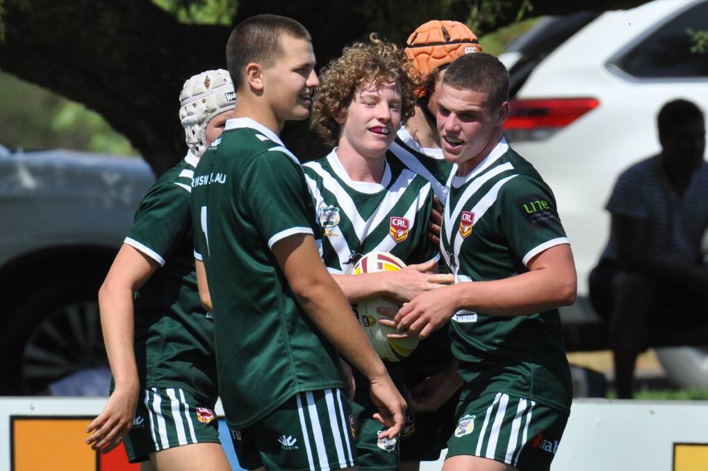 THAT TIME AGAIN: Western Rams under 16s players - including Parkes' Finnley Neilsen (right) - celebrate a Johns Cup try last season. Photo: NICK McGRATH